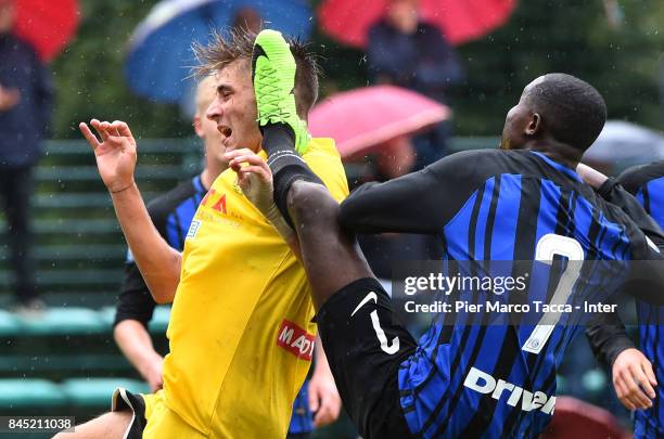 Filippo Paoluzzi of Udinese Calcio hit in the face by Stephen Danso of FC Internazionale U19 during the Serie A Primavera match between FC...