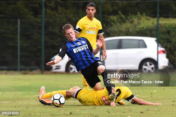 Xian Emmers of FC Internazionale competes for the ball with Filippo Paoluzzi of Udine Calcio U19 during the Serie A Primavera match between FC...