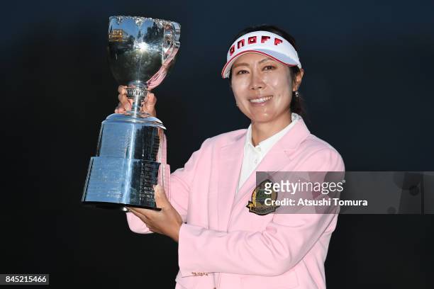 Ji-Hee Lee of South Korea poses with the trophy after winning the 50th LPGA Championship Konica Minolta Cup 2017 at the Appi Kogen Golf Club on...
