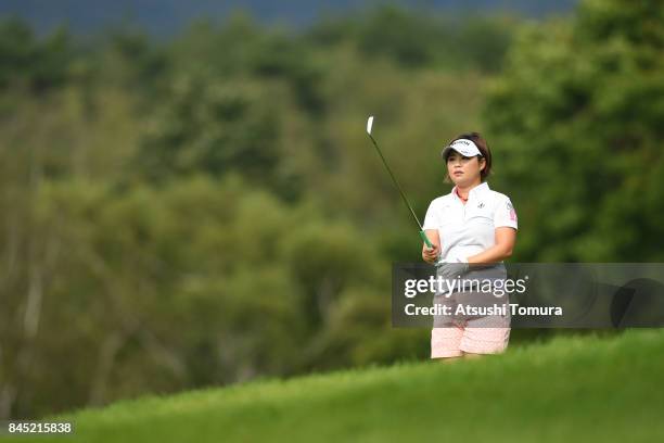 Hiroko Azuma of Japan hits her second shot on the 5th hole during the final round of the 50th LPGA Championship Konica Minolta Cup 2017 at the Appi...