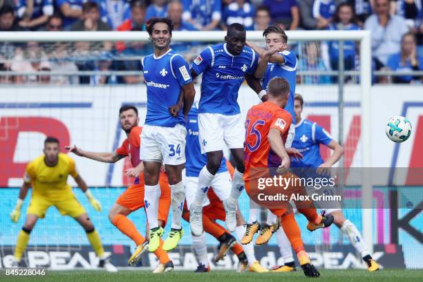 Alexander Merkel of Bochum shoots a free-kick during the Second Bundesliga match between SV Darmstadt 98 and VfL Bochum 1848 at Merck-Stadion am...