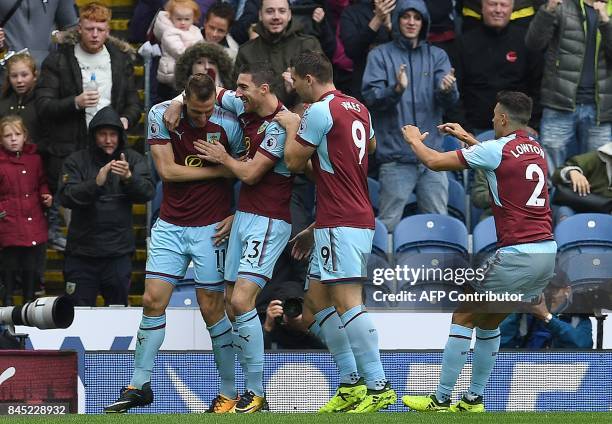 Burnley's New Zealand striker Chris Wood celebrates scoring his team's first goal with teammates Burnley's Irish defender Stephen Ward Burnley's...