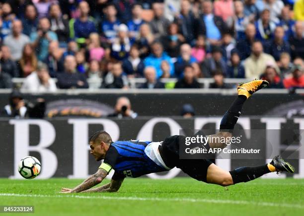 Inter Milan's Argentinian forward Mauro Icardi falls during the Italian Serie A football match between Inter Milan and Spal at San Siro Stadium in...