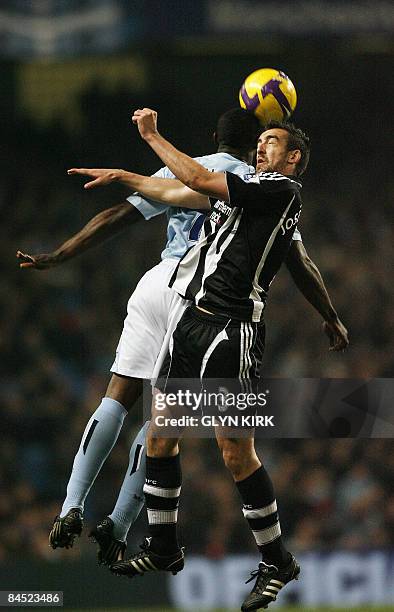 Newcastle's Spanish Defender Sanchez Jose Enrique vies with Manchester City's English Defender Micah Richards during their Premier League football...