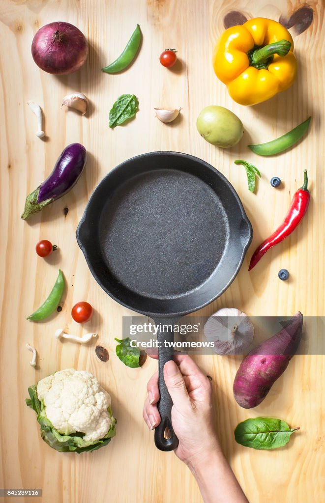Flat lay conceptual vegan food on wooden background.