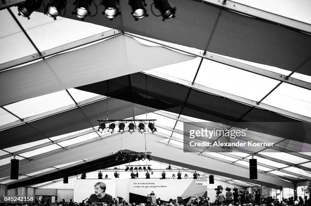 German Chancellor and Christian Democrat Angela Merkel speaks to supporters at a fest tent during an election campaign stop on September 10, 2017 in...