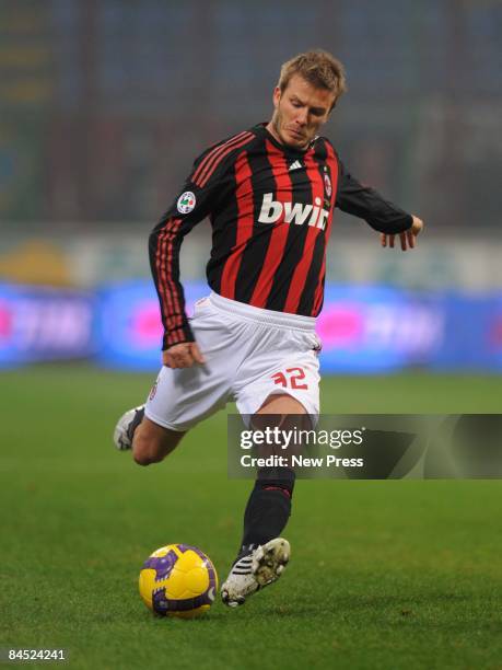 David Beckham of AC Milan plays a ball during the Serie A match between Milan and Genoa at the Stadio Giuseppe Meazza on January 28, 2009 in Milan,...