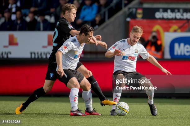 Mattias Svanberg of Malmo FF , Nordin Gerzic of Orebro SK & Johan Martensson of Orebro SK during the Allsvenskan match between Orebro SK and Malmo FF...