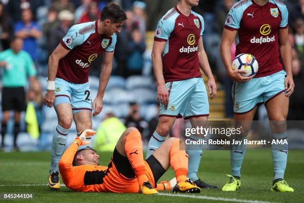 Tom Heaton of Burnley down injured during the Premier League match between Burnley and Crystal Palace at Turf Moor on September 10, 2017 in Burnley,...