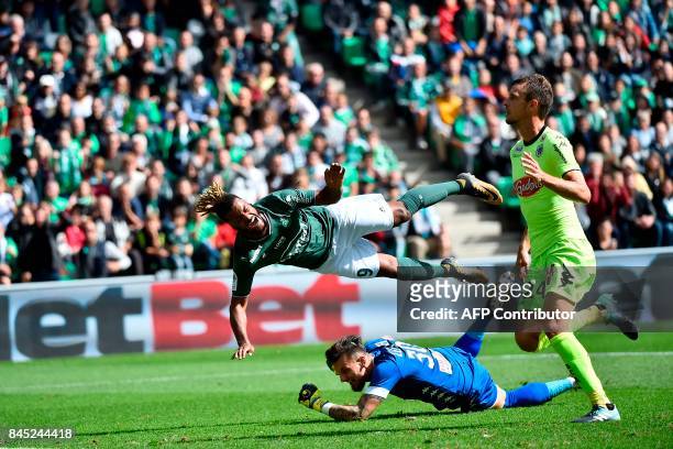 Saint-Etienne's French forward Lois Diony vies with Anger's French goalkeeper Alexandre Letellier during the French L1 football match between...