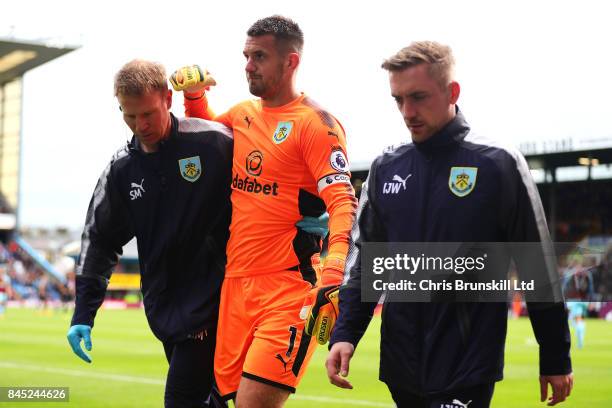 Tom Heaton of Burnley leaves the field through injury during the Premier League match between Burnley and Crystal Palace at Turf Moor on September...