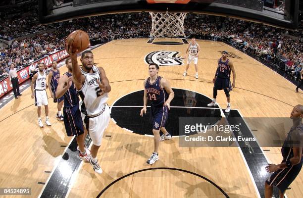 Tim Duncan of the San Antonio Spurs shoots a layup during the game against the New Jersey Nets at AT&T Center on January 23, 2009 in San Antonio,...