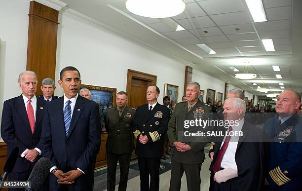 President Barack Obama, alongside US Vice President Joe Biden, the Joint Chiefs of Staff and US Secretary of Defense Robert Gates , speaks to the...