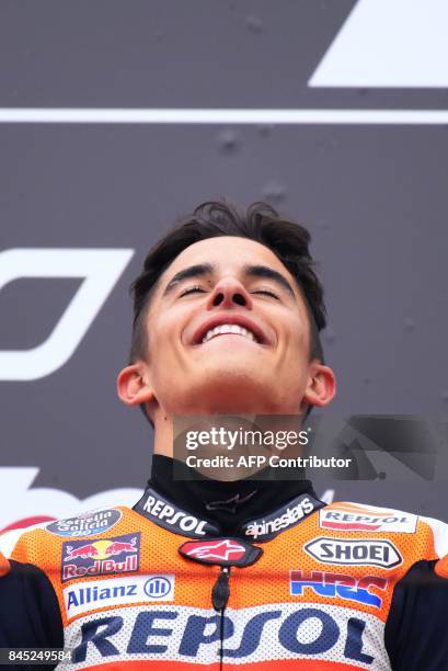 Repsol Honda Team's Spanish rider Marc Marquez celebrates on the podium after winning the San Marino Moto GP Grand Prix at the Marco Simoncelli...