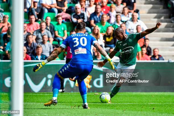 Saint-Etienne's French midfielder Bryan Dabo shoots on goal against Angers' French goalkeeper Alexandre Letellier during the French L1 football match...