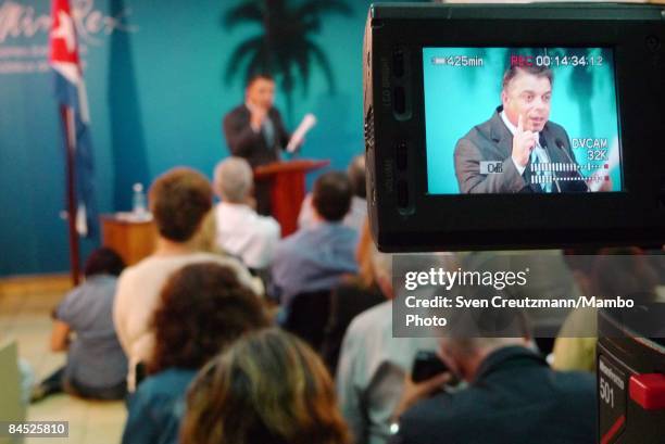 Cuba's Foreign Minister Felipe Perez Roque, seen on a monitor, presents Cuba's report to the Universal Periodic of the Human Rights Council, at the...