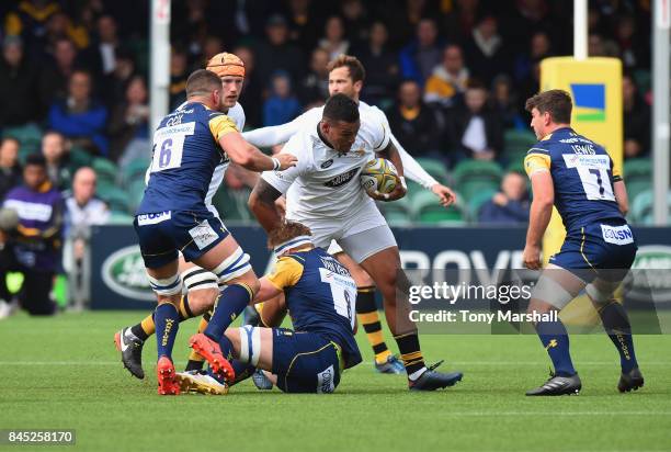 Van Velze of Worcester Warriors tackles Nathan Hughes of Wasps during the Aviva Premiership match between Worcester Warriors and Wasps at Sixways...