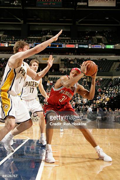 Charlie Villanueva of the Milwaukee Bucks posts up against Troy Murphy of the Indiana Pacers at Conseco Fieldhouse on January 28, 2009 in...