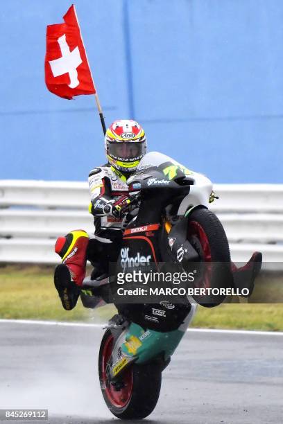 Kiefer Racing's Swiss rider Dominique Aegerter celebrates after winning the San Marino Moto2 Grand Prix race at the Marco Simoncelli Circuit in...
