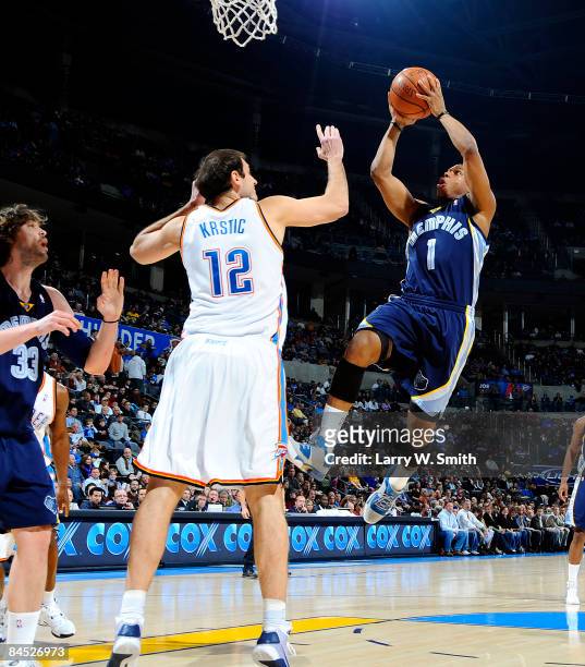 Kyle Lowry of the Memphis Grizzlies goes to the basket against Nenad Krstic of the Oklahoma City Thunder at the Ford Center on January 28, 2009 in...
