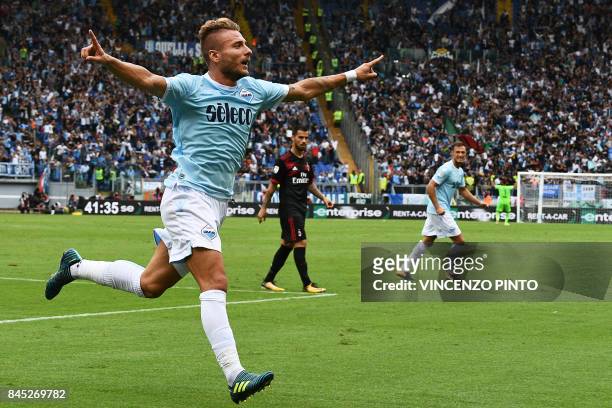 Lazio's forward from Italy Ciro Immobile celebrates after scoring his second goal during the Italian Serie A football match Lazio vs AC Milan on...