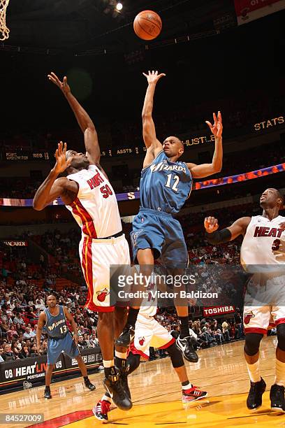 Juan Dixon of the Washington Wizards shoots against Joel Anthony of the Miami Heat on January 28, 2009 at the American Airlines Arena in Miami,...