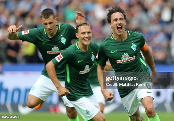 Thomas Delaney of Bremen jubilates with team mates after scoring the second goal during the Bundesliga match between Hertha BSC and SV Werder Bremen...