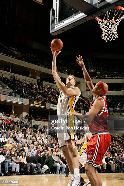 Rasho Nesterovic of the Indiana Pacers shoots over Charlie Villanueva of the Milwaukee Bucks at Conseco Fieldhouse on January 28, 2009 in...