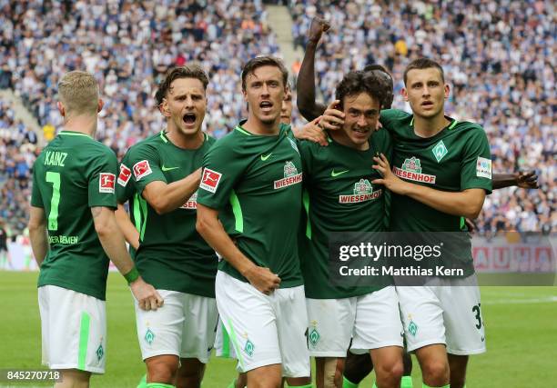 Thomas Delaney of Bremen jubilates with team mates after scoring the second goal during the Bundesliga match between Hertha BSC and SV Werder Bremen...