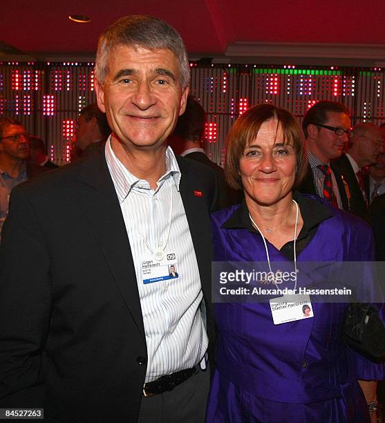 Juergen Hambrecht, chairman of the board of executive directors of BASF, and his wife Ingeborg Straehler-Hambrecht attend the DLD Nightcap at the...