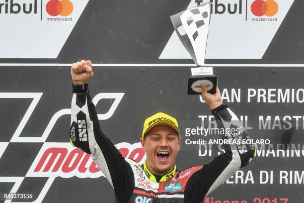 Kiefer Racing Team's Swiss rider Dominique Aegerter celebrates on the podium the first place after winning the San Marino Moto2 Grand Prix at the...