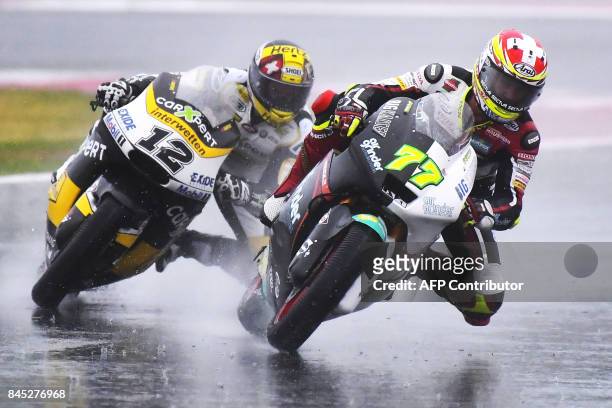Carxpert's rider Thomas Luthi from Switzerland and Kiefer Racing's rider Dominique Aegerter from Switzerland compete during the San Marino Moto2...