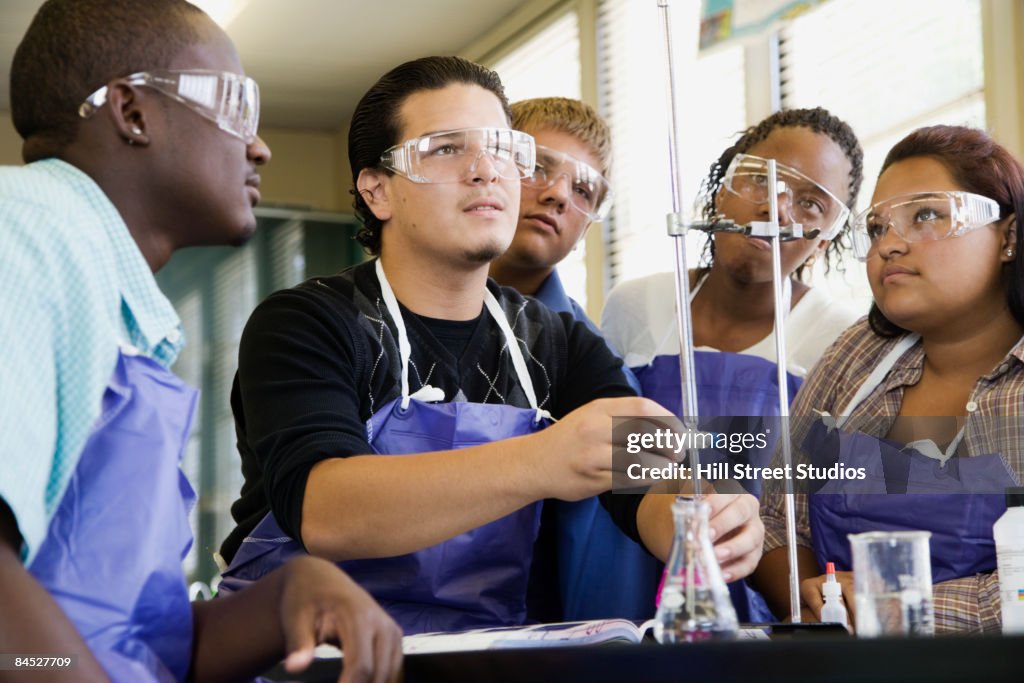 Students performing experiment in chemistry lab