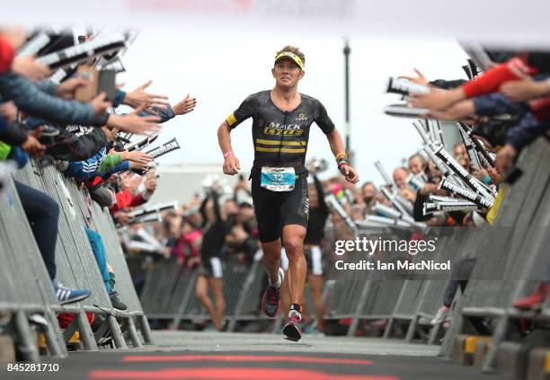 Cameron Wurf of Australia wins the Men's race during the Ironman Wales competiton on September 10, 2017 in Tenby, Wales.