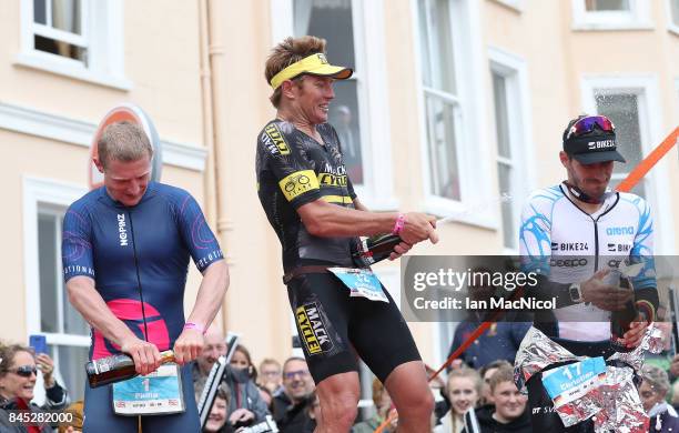 Cameron Wurf of Australia celebrates on the podium after he wins the Men's race during the Ironman Wales competiton on September 10, 2017 in Tenby,...
