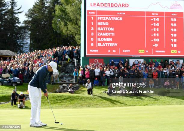 Matthew Fitzpatrick of England putts on on the 18th hole to win the play off during Day Five of the Omega European Masters at Crans-sur-Sierre Golf...