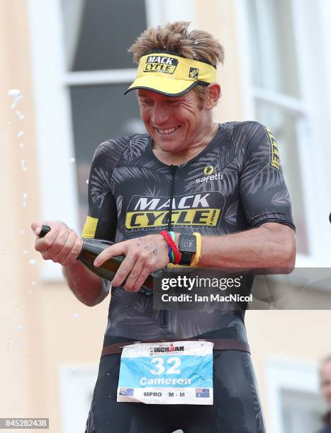 Cameron Wurf of Australia celebrates after he wins the Men's race during the Ironman Wales competiton on September 10, 2017 in Tenby, Wales.