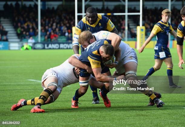 Matt Cox of Worcester Warriors is tackled by Joe Launchbury of Wasps during the Aviva Premiership match between Worcester Warriors and Wasps at...