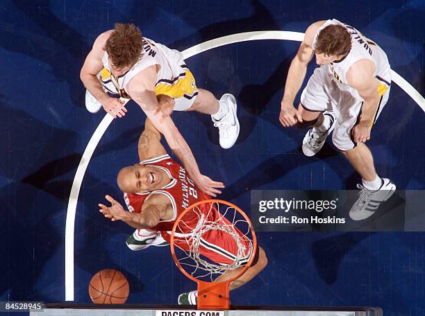 Rasho Nesterovic of the Indiana Pacers shoots against Charlie Villanueva of the Milwaukee Bucks at Conseco Fieldhouse on January 28, 2009 in...