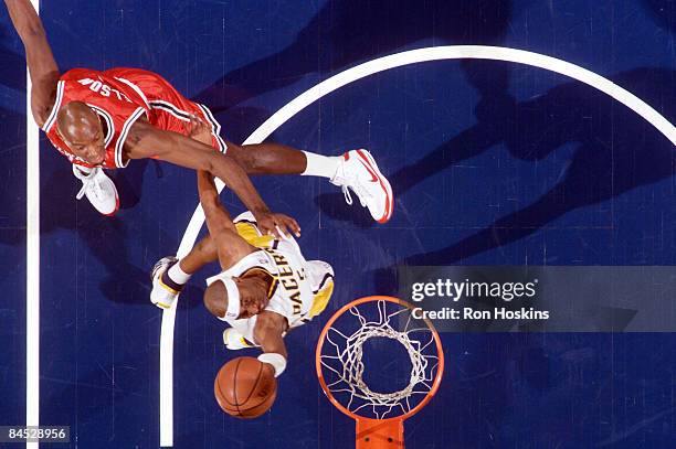 Rasho Nesterovic of the Indiana Pacers shoots ahead of Charlie Villanueva of the Milwaukee Bucks at Conseco Fieldhouse on January 28, 2009 in...