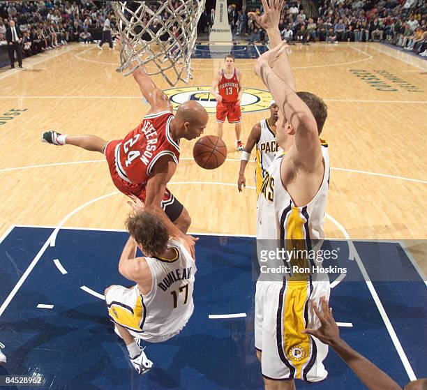 Richard Jeffferson of the Milwaukee Bucks falls over Mike Dunleavy of the Indiana Pacers at Conseco Fieldhouse on January 28, 2009 in Indianapolis,...