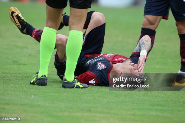 Fabio Pisacane of Cagliari injured during the Serie A match between Cagliari Calcio and FC Crotone at Stadio Sant'Elia on September 10, 2017 in...