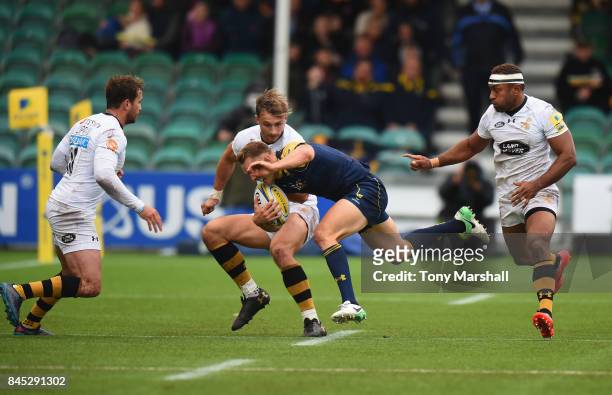 Perry Humphreys of Worcester Warriors is tackled by Josh Bassett of Wasps during the Aviva Premiership match between Worcester Warriors and Wasps at...