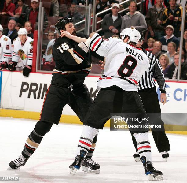 Matt Walker of the Chicago Blackhawks fights with George Parros of the Anaheim Ducks during the game on January 28, 2009 at Honda Center in Anaheim,...