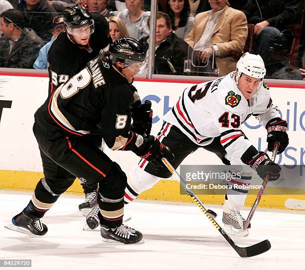 James Wisniewski of the Chicago Blackhawks handles the puck against Teemu Selanne of the Anaheim Ducks during the game on January 28, 2009 at Honda...