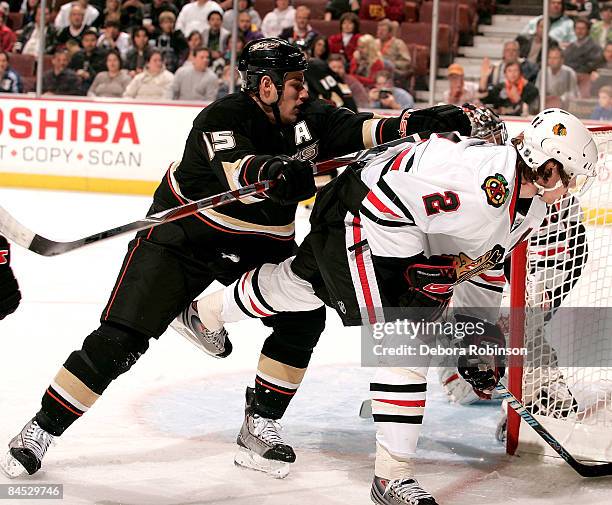 Duncan Keith of the Chicago Blackhawks is pushed from behind from Ryan Getzlaf of the Anaheim Ducks during the game on January 28, 2009 at Honda...