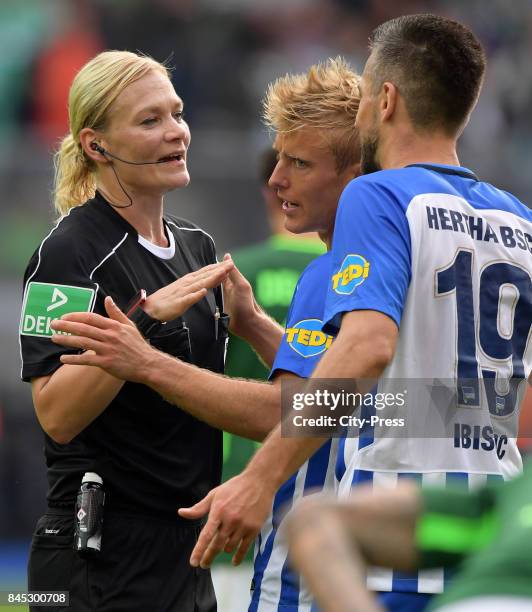 Match referee Bibiana Steinhaus, Per Skjelbred and Vedad Ibisevic of Hertha BSC during the game between Hertha BSC and Werder Bremen on September 10,...