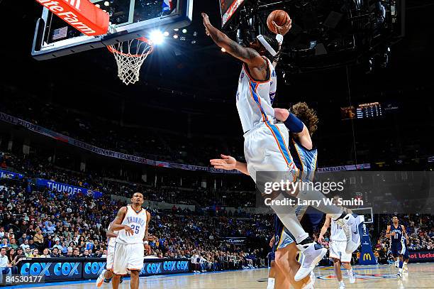 Chris Wilcox of the Oklahoma City Thunder goes up for a dunk against Marc Gasol of the Memphis Grizzlies at the Ford Center on January 28, 2009 in...