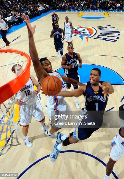 Kyle Lowry of the Memphis Grizzlies goes to the basket against Desmond Mason of the Oklahoma City Thunder at the Ford Center on January 28, 2009 in...