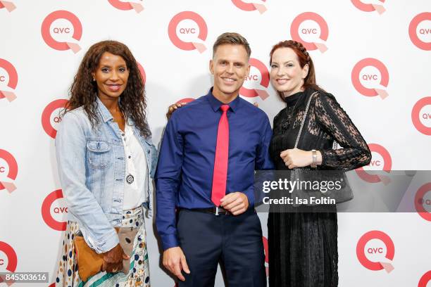 Model Liz Baffoe and the QVC presenters Volker Kirst and Thania Metternich attend a QVC event during the Vogue Fashion's Night Out on September 8,...